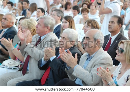 LIMASSOL,CYPRUS-JUNE 4: Ambassador of the Russian Federation, V. Shumskiy (left); President of Cyprus, D. Christofias (center); and A. Christou (right) attend the Cyprus-Russian festival on June 4, 2011 in Limassol, Cyprus.