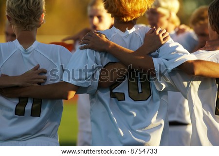 Boys high school soccer huddle