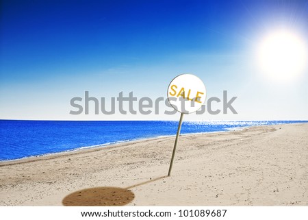 beach , with perfect blue water and blue sky and sale sign