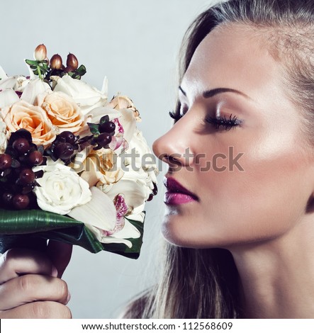 young beautiful woman with flowers , glamour makeup , make-up , perfect clean skin , long hair