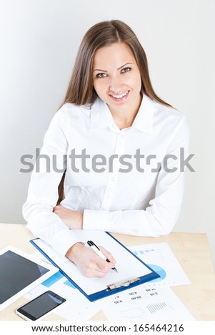 smiling business woman . office job . working at the office