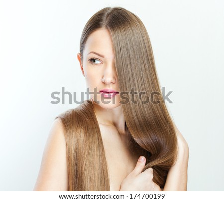 closeup portrait of a beautiful young woman with elegant long shiny hair.