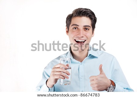 young businessman happy that it has solved to drink water