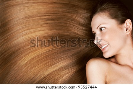 closeup portrait of a beautiful young woman with elegant long shiny hair , concept hairstyle