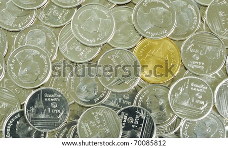 Golden coin among Silver coins