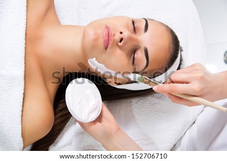 Facial mask - Woman at beauty treatment at luxury spa beauty treatment