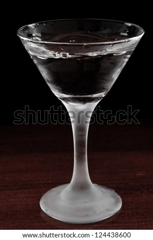 frozen martini on a black background served plain and dry