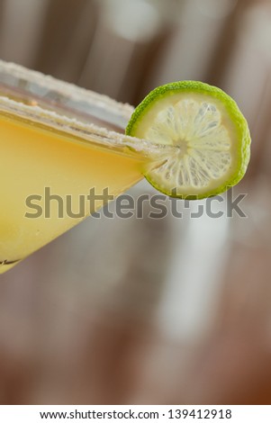 classic margarita served chilled in a martini glass with a float of orange liqueur