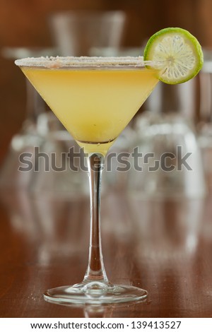 classic margarita served chilled in a martini glass with a float of orange liqueur