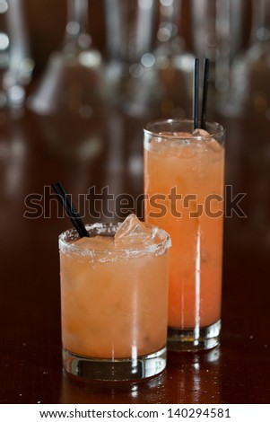 salty dog and greyhound cocktails served on a busy bar top