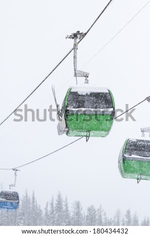 gondola lift or cable car in the mountains of Idaho in snowy winter conditions