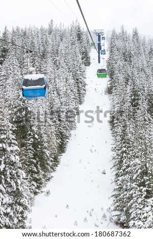 gondola lift or cable car in the mountains of Idaho in snowy winter conditions