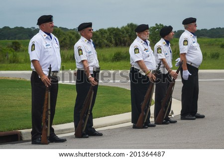 Sarasota, Florida - June 02 : American Legion, Honor Guard performing a full service military funeral; June 02 2014 in Sarasota VA National Cemetery in Florida