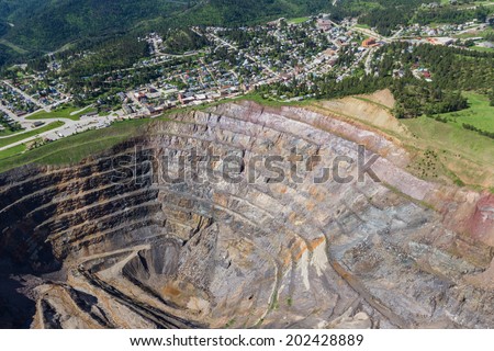 aerial view of an abandoned open pit mine and the town of Lead, South Dakota