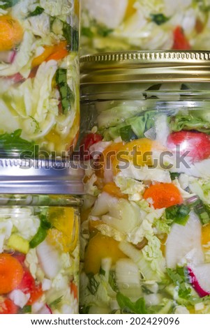 home made cultured or fermented vegetables in  glass jars