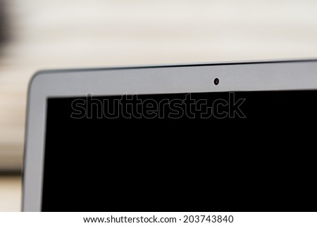 close up of a web cam on a laptop in a home setting