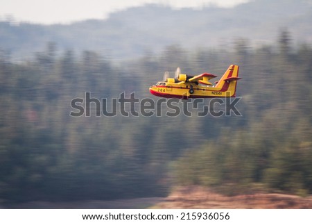 Lost Creek Lake, Oregon  - September 7 : Supperscooper plane after scoping water out of Lost Creek Lake to fight the 790 Fire, September 7 2014 in Lost Creek Lake, Prospect Oregon