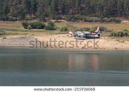 Lost Creek Lake, Oregon  - September 7 : Supperscooper plane after scoping water out of Lost Creek Lake to fight the 790 Fire, September 7 2014 in Lost Creek Lake, Prospect Oregon