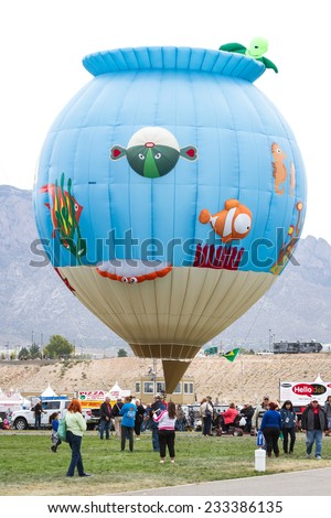 Albuquerque New Mexico - October 8 : Hot air balloons lifting off in with families and crews enjoying the Balloon Fiesta show, October 8 2014 in Albuquerque, New Mexico