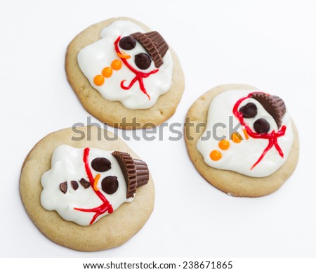 holiday cookies with a melted snowman for a fun seasonal concept on a white background