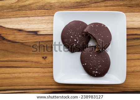 home made sea salted caramels on a white plate with a bite mark