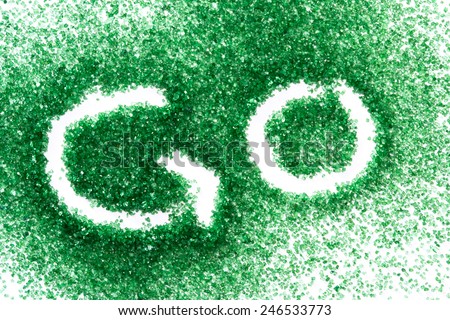 background with green sugar and the word go for a concept