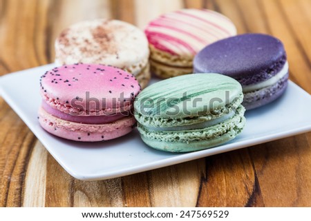 french macaroons on a white plate in a variety of colors an d flavors