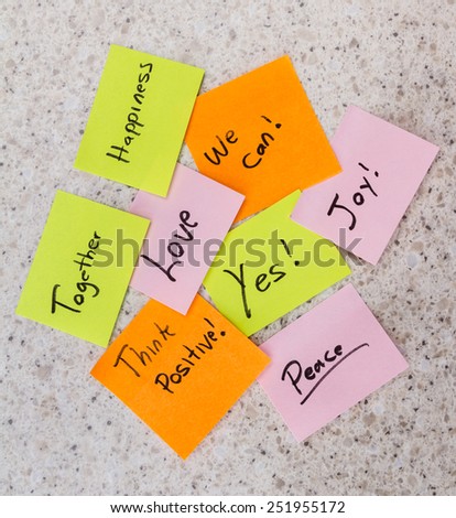 office desk with multiple sick notes with positive messages on them