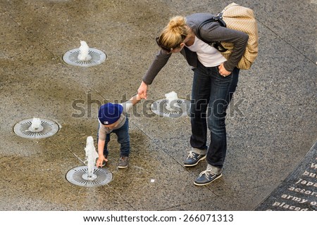 Hollywood & Highland Center, Hollywood, California - February 08 : Child playing in the water fountains, February 08 2015 in the Hollywood & Highland Center, Hollywood, California.