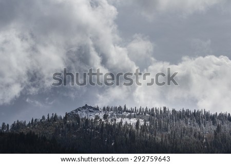 snow storm covering he fire watch tower at the base of the Sierra Nevada mountains from the Nevada Side