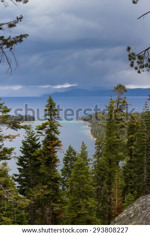 Emerald Bay in Lake Tahoe with dark stormy clouds in a Spring afternoon