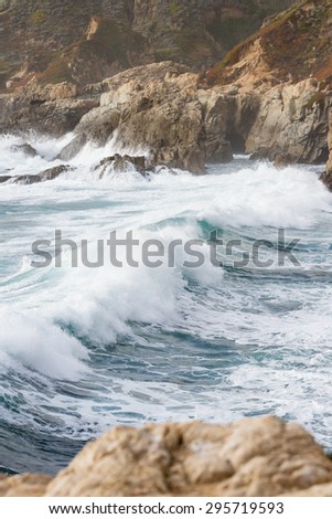 beautiful scene of the California coast on a cloudy day with its classic dramatic coastline lined with rocks and cliffs