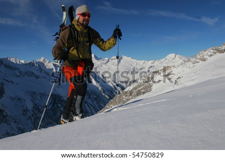 Ski touring in winter mountains. Outdoor pursuit