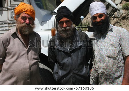 INDIA - SEPTEMBER 2: Three Sikh drivers in front of their lorry, north India September 2, 2008 in India
