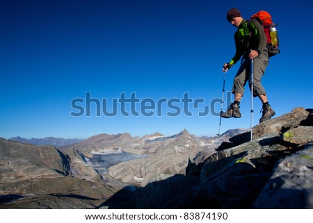 Mountain hiker with backpack high in the mountains