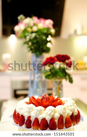 Strawberry cake with whipped cream with slices of strawberries