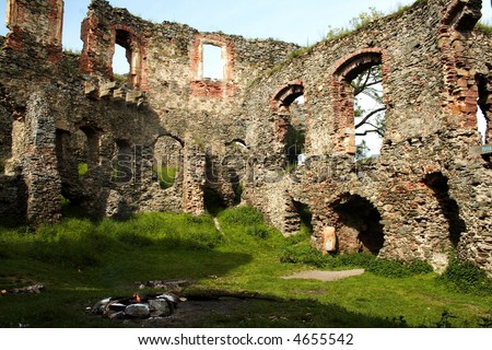 Ancient ruined fortress with fireplace in the middle