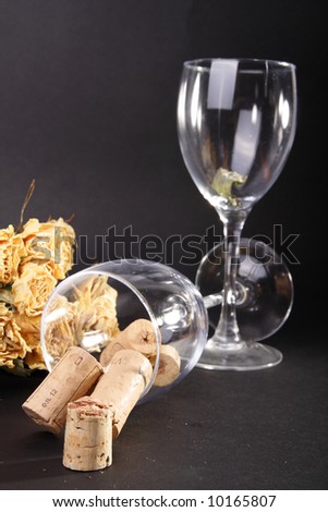 After the valentine, dried bunch of yellow roses and empty wine glasses