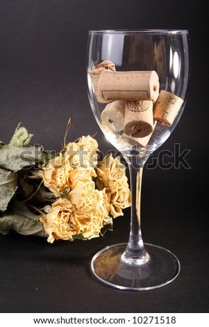 After the valentine, dried bunch of yellow roses and empty wine glasses