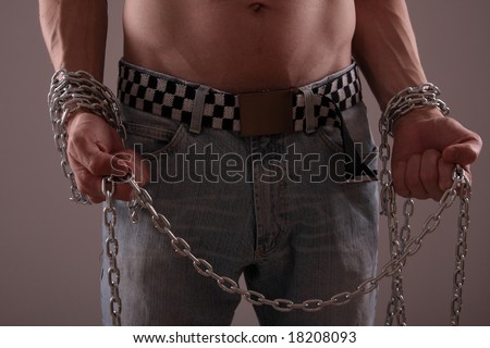 Closeup of man\'s body with hanging chain