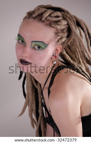 Young woman with dread locks and punk clothing