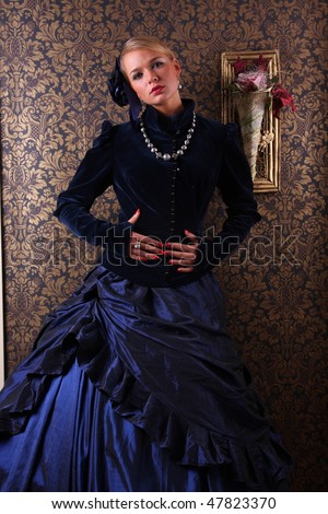 Young woman posing in victorian dress