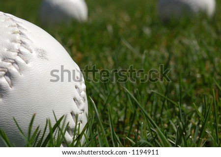 softballs in grass