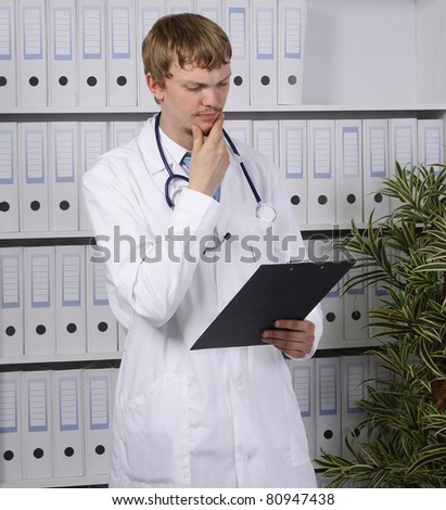 young male doctor portrait with background