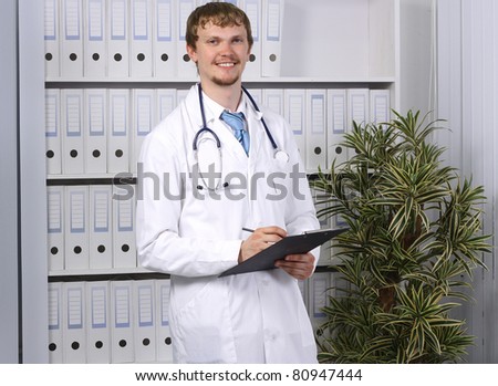smiling young male doctor portrait with background