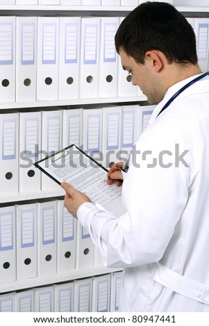 young male doctor portrait with background