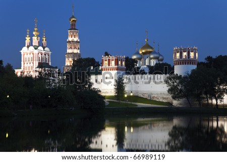 New Maidens\' Convent (Novodevichy Monastery). Night view  from pond, reflection in water. Moscow, Russia.