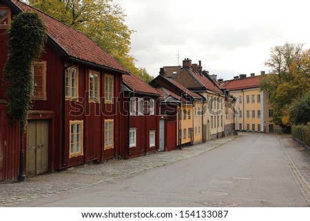 STOCKHOLM, SWEDEN - OCTOBER 16:  Old wooden houses by a street in central Stockholm (at Nytorget on Sdermalm) shown on October 16, 2012 in Stockholm.