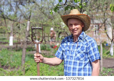 mature man working in the garden