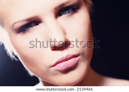 Woman\'s face, she has different eyes, one eye is green and other eye is brown
